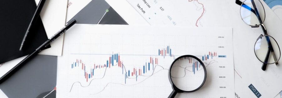 Financial analysis documents and charts used for planning a Saudi business expansion into India