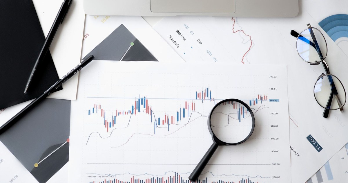 Financial analysis documents and charts used for planning a Saudi business expansion into India