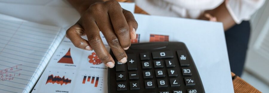 Analyst working through a discounted cash flow model, illustrating business valuation methods