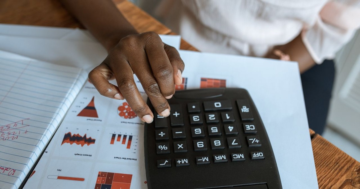 Analyst working through a discounted cash flow model, illustrating business valuation methods
